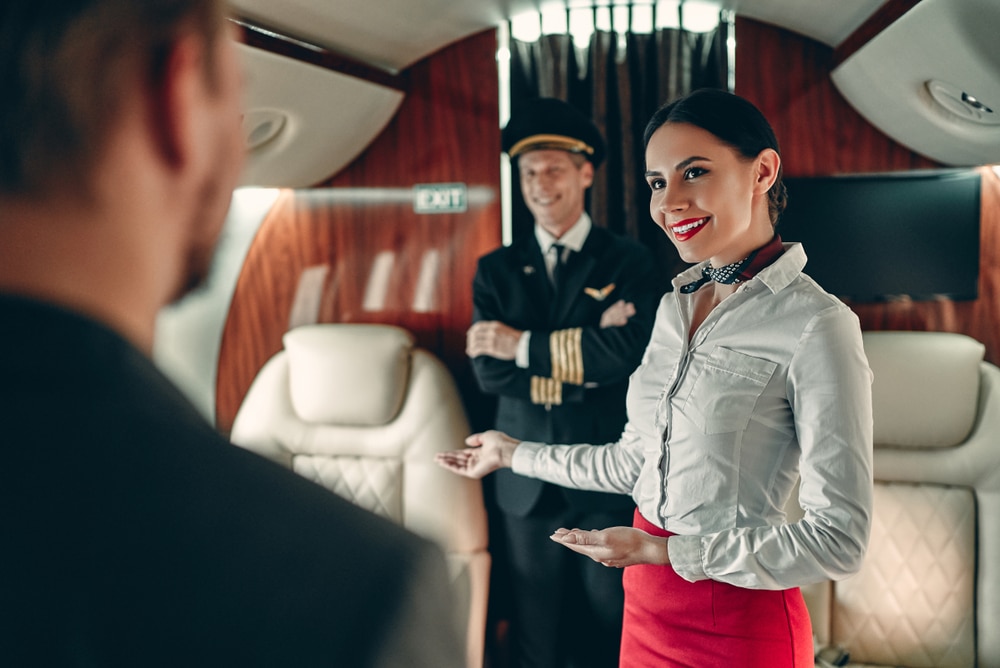Senior,Experienced,Pilot,In,Uniform,And,Beautiful,Female,Flight,Attendant